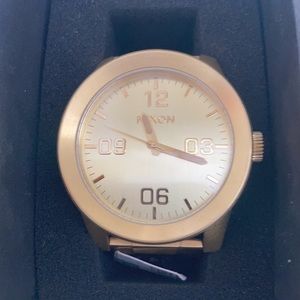 Nixon mens gold watch